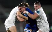 29 November 2024; Scott Penny of Leinster is tackled by Aidan Morgan, left, and Nick Timoney of Ulster during the United Rugby Championship match between Ulster and Leinster at Kingspan Stadium in Belfast. Photo by Ramsey Cardy/Sportsfile