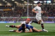 29 November 2024; Jimmy O'Brien of Leinster dives over to score his side's third try despite the attention of Michael Lowry of Ulster during the United Rugby Championship match between Ulster and Leinster at Kingspan Stadium in Belfast. Photo by Ramsey Cardy/Sportsfile