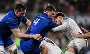 29 November 2024; Diarmuid Mangan of Leinster, supported by Jack Conan, is tackled by Michael Lowry, centre, and Ben Carson of Ulster during the United Rugby Championship match between Ulster and Leinster at Kingspan Stadium in Belfast. Photo by Ramsey Cardy/Sportsfile