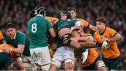 30 November 2024; Rob Valetini of Australia is tackled by Caelan Doris, 8, and James Ryan of Ireland during the Autumn Nations Series match between Ireland and Australia at the Aviva Stadium in Dublin. Photo by Ramsey Cardy/Sportsfile