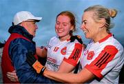 30 November 2024; Mungret St Paul's players Aoife Morrissey, centre, and Claire Coughlan celebrate with manager John Horgan after their side's victory in the AIB LGFA All-Ireland Junior Club Championship semi-final match between Coolera/Strandhill of Sligo and Mungret St Paul's of Limerick at Kilcoyne Park in Tubbercurry, Sligo. Photo by Shauna Clinton/Sportsfile