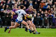 30 November 2024; Ailbhe Davoren of Kilmacud Crokes in action against Kate Murray, left, and Eilis Lynch of Castleisland Desmonds during the AIB LGFA All-Ireland Senior Club Championship semi-final match between Kilmacud Crokes of Dublin and Castleisland Desmonds of Kerry at Páirc de Burca in Stillorgan, Dublin. Photo by Daire Brennan/Sportsfile