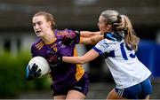 30 November 2024; Lauren Magee of Kilmacud Crokes in action against Kate O’Connor of Castleisland Desmonds during the AIB LGFA All-Ireland Senior Club Championship semi-final match between Kilmacud Crokes of Dublin and Castleisland Desmonds of Kerry at Páirc de Burca in Stillorgan, Dublin. Photo by Daire Brennan/Sportsfile
