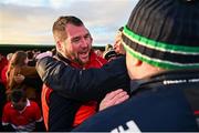 1 December 2024; Coolera Strandhill manager John McPartland, left, celebrates with supporters after the AIB Connacht GAA Senior Club Football Championship final match between Coolera-Strandhill and Pádraig Pearses at Markievicz Park GAA Stadium in Sligo. Photo by Tyler Miller/Sportsfile