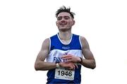 1 December 2024; Sean M McGinley of Finn Valley AC, Donegal, crosses the line to win the novice men's 6000m during the 123.ie National Novice and Juvenile Uneven Age Cross Country Championships at Tramore Racecourse in Tramore, Waterford. Photo by Sam Barnes/Sportsfile