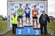 1 December 2024; Novice men's 6000m medallists, Sean M McGinley of Finn Valley AC, Donegal, gold, centre, Oisin Murray of An Ríocht AC, Kerry, silver, left, and Daniel Ryan Ellis of Nenagh Olympic AC, Tipperary, bronze, right, with Athletics Ireland President John Cronin, far right, during the 123.ie National Novice and Juvenile Uneven Age Cross Country Championships at Tramore Racecourse in Tramore, Waterford. Photo by Sam Barnes/Sportsfile