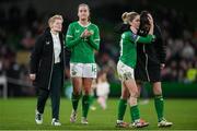 3 December 2024; Republic of Ireland head coach Eileen Gleeson, with players from second from left, Anna Patten, Denise O'Sullivan and Niamh Fahey after the UEFA Women's EURO 2025 Play-off Round Two second leg match between Republic of Ireland and Wales at the Aviva Stadium in Dublin. Photo by Stephen McCarthy/Sportsfile