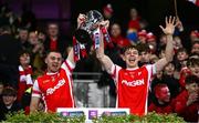 30 November 2024; Cathal Ó Giolláin, left, and Charlie McMorrow of Cuala lift the cup after the AIB Leinster GAA Senior Club Football Championship final match between Cuala of Dublin and Ardee St Mary's of Louth at Croke Park in Dublin. Photo by Ben McShane/Sportsfile