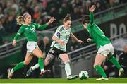3 December 2024; Rachel Rowe of Wales in action against Republic of Ireland players Denise O'Sullivan, left, and Niamh Fahey during the UEFA Women's EURO 2025 Play-off Round Two second leg match between Republic of Ireland and Wales at the Aviva Stadium in Dublin. Photo by Shauna Clinton/Sportsfile