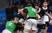 4 December 2024; Lee Fitzpatrick of Newbridge College is tackled by Gonzaga College players John Brophy, left, and Peter Dockery during the Leinster Rugby Schools Senior League Division 1A Play-offs Final match between Newbridge College and Gonzaga College at Energia Park in Dublin. Photo by Seb Daly/Sportsfile