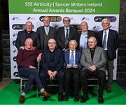6 December 2024; Members of the Republic of Ireland's 1974 team, back row, from left, Liam Brady, Terry Mancini, Paddy Roche, Paddy Mulligan and Jimmy Holmes, with, front row, Mick Martin, Terry Conroy, John Giles and Eoin Hand accept the International Achievement Award during the SSE Airtricity/Soccer Writers Ireland Awards 2024 at Clontarf Castle in Dublin. Photo by Stephen McCarthy/Sportsfile