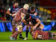 7 December 2024; Pierre Boudehent of Stade Francais Paris is tackled by Munster players Fineen Wycherley, left, and Gavin Coombes lduring the Champions Cup Round 1 match between Munster and Stade Francais Paris at Thomond Park in Limerick. Photo by Seb Daly/Sportsfile