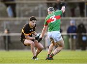 8 December 2024; Tony Brosnan of Dr Crokes in action against Willie Eviston of Loughmore Castleiney during the AIB Munster GAA Senior Club Football Championship final match between Dr Crokes of Kerry and Loughmore Castleiney of Tipperary at Mallow GAA Grounds in Cork. Photo by Piaras Ó Mídheach/Sportsfile