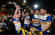 8 December 2024; Niall Kelly of Errigal Ciarán, left, celebrates with the Seamus McFerran Cup after the AIB Ulster GAA Senior Club Football Championship final match between Errigal Ciarán of Tyrone and Kilcoo of Down at BOX-IT Athletic Grounds in Armagh. Photo by Ramsey Cardy/Sportsfile