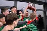 12 December 2024; Boyne Community School Trim captain Tymon Marcyniak celebrates with the trophy alongside his teammates after their side's victory in the Leinster Rugby Schools League Junior Development Shield Final match between Moate Community School, Westmeath, and Boyne Community School Trim, Meath, at Energia Park in Dublin. Photo by Seb Daly/Sportsfile