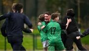 12 December 2024; Gareth Reilly of Boyne Community School Trim, centre, celebrates with teammates and supporter after their side's victory in the Leinster Rugby Schools League Junior Development Shield Final match between Moate Community School, Westmeath, and Boyne Community School Trim, Meath, at Energia Park in Dublin. Photo by Seb Daly/Sportsfile