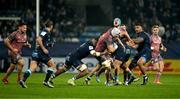 13 December 2024; Fineen Wycherley of Munster is tackled by Mathieu Babillot of Castres Olympique during the Champions Cup Pool 3 match between Castres Olympique and Munster at Stade Pierre Fabre in Castres, France. Photo by Brendan Moran/Sportsfile
