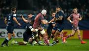 13 December 2024; Fineen Wycherley of Munster is tackled by Mathieu Babillot of Castres Olympique during the Champions Cup Pool 3 match between Castres Olympique and Munster at Stade Pierre Fabre in Castres, France. Photo by Brendan Moran/Sportsfile