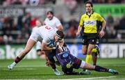 14 December 2024; Jude Postlethwaite of Ulster is tackled by Joey Carbery of Bordeaux-Begles during the Champions Cup Pool 1 match between Ulster and Bordeaux Begles at Kingspan Stadium in Belfast. Photo by Ramsey Cardy/Sportsfile