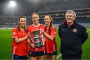 14 December 2024; Kilkerrin-Clonberne players, the Divilly sisters, from left, Niamh Divilly, Siobhan Divilly and Olivia Divilly celebrate with their father Michael after the AIB LGFA All-Ireland Senior Club Championship final match between Kilmacud Crokes of Dublin and Kilkerrin-Clonberne of Galway at Croke Park in Dublin. Photo by Piaras Ó Mídheach/Sportsfile