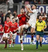 20 December 2024; John Cooney of Ulster in action against Shane Daly of Munster during the United Rugby Championship match between Ulster and Munster at Kingspan Stadium in Belfast. Photo by Ramsey Cardy/Sportsfile