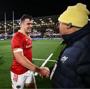 20 December 2024; Tom Farrell of Munster is congratulated by Munster performance consultant Chris Boyd after the United Rugby Championship match between Ulster and Munster at Kingspan Stadium in Belfast. Photo by Ramsey Cardy/Sportsfile