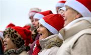 21 December 2024; Members of the Harson Jockey Choir, including Rose Connolly, centre, from Loughmore in Tipperary, sing Christmas songs at Thurles Racecourse in Tipperary. Photo by Shauna Clinton/Sportsfile