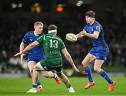 21 December 2024; Jordie Barrett of Leinster throws a pass under pressure from Cathal Forde of Connacht during the United Rugby Championship match between Leinster and Connacht at the Aviva Stadium in Dublin. Photo by Brendan Moran/Sportsfile