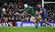 21 December 2024; Mack Hansen of Connacht offloads under pressure from Aitzol Arenzana-King of Leinster during the United Rugby Championship match between Leinster and Connacht at the Aviva Stadium in Dublin. Photo by Brendan Moran/Sportsfile