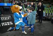 21 December 2024; Leinster mascots Kevin Menton and Douglas Geddes with Leo the Lion before the United Rugby Championship match between Leinster and Connacht at the Aviva Stadium in Dublin. Photo by Brendan Moran/Sportsfile