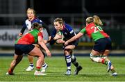 22 December 2024; Eve Higgins of Wolfhounds in action against Clovers players Enya Breen, left, and Edel McMahon during the Celtic Challenge match between Wolfhounds and Clovers at Energia Park in Dublin. Photo by Seb Daly/Sportsfile