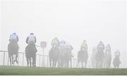 27 December 2024; A general view of runners and riders amidst heavy fog during the Paddy Power 3-Y-O Maiden Hurdle on day two of the Leopardstown Christmas Festival at Leopardstown Racecourse in Dublin. Photo by David Fitzgerald/Sportsfile