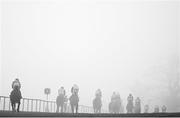 27 December 2024; (EDITOR'S NOTE; Image has been converted to black & white) A general view of runners and riders amidst heavy fog during the Paddy Power 3-Y-O Maiden Hurdle on day two of the Leopardstown Christmas Festival at Leopardstown Racecourse in Dublin. Photo by David Fitzgerald/Sportsfile