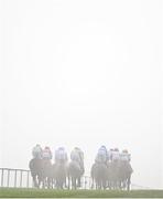 27 December 2024; A general view of runners and riders amidst heavy fog during the Paddy Power 3-Y-O Maiden Hurdle on day two of the Leopardstown Christmas Festival at Leopardstown Racecourse in Dublin. Photo by David Fitzgerald/Sportsfile