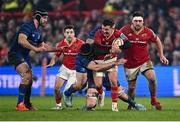 27 December 2024; Billy Burns of Munster is tackled by James Ryan of Leinster during the United Rugby Championship match between Munster and Leinster at Thomond Park in Limerick. Photo by Seb Daly/Sportsfile