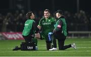 28 December 2024; Peter Dooley of Connacht receives medical attention during the United Rugby Championship match between Connacht and Ulster at the Dexcom Stadium in Galway. Photo by Seb Daly/Sportsfile