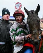 5 January 2025; The Yellow Clay, right, with jockey Sam Ewing, centre, and trainer Gordon Elliott after winning The Lawlor's Of Naas Novice Hurdle at Naas Racecourse in Kildare. Photo by Shauna Clinton/Sportsfile