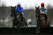 5 January 2025; Ile Atlantique, with Paul Townend up, left, and Firefox, with Sam Ewing up, right, jump the last on their way, first time round, during the The Racing Post Novice Steeplechase at Naas Racecourse in Kildare. Photo by Shauna Clinton/Sportsfile