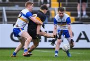 11 January 2025; Michael Potts of Dr Crokes in action against Peter Harte, left, and Niall Kelly of Errigal Ciarán during the AIB GAA Football All-Ireland Senior Club Championship semi-final match between Dr Crokes and Errigal Ciarán at Cedral St Conleth's Park in Newbridge, Kildare. Photo by Piaras Ó Mídheach/Sportsfile