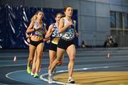 11 January 2025; Evelyn Coughlan of Tullamore Harriers AC, Offaly, right, leads the field in the women's 1500m during day one of the 123.ie National Indoor AAI Games and Combined Events at the National Indoor Arena on the Sport Ireland Campus in Dublin. Photo by Sam Barnes/Sportsfile