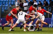15 January 2025; Darragh Redmond of CUS evades the tackle of Matt McGovern, bottom, and Eoin Croysdill of Presentation College, Bray, right, during the Bank of Ireland Leinster Rugby Boys Schools Vinnie Murray Cup quarter-final match between CUS and Presentation College, Bray at Energia Park in Dublin. Photo by Tyler Miller/Sportsfile