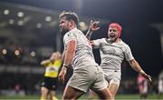 17 January 2025; Ben Carson of Ulster celebrates with teammate Mike Lowry, right, after scoring their side's fifth try during the Investec Champions Cup Pool 1 match between Ulster and Exeter Chiefs at the Kingspan Stadium in Belfast. Photo by Ben McShane/Sportsfile