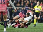 17 January 2025; John Cooney of Ulster is tackled by Will Haydon-Wood and Christ Tshiunza of Exeter during the Investec Champions Cup Pool 1 match between Ulster and Exeter Chiefs at the Kingspan Stadium in Belfast. Northern Ireland. Photo by John Dickson/Sportsfile