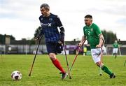 18 January 2025; Michael Lennon of Scotland in action against Neil Hoey of Republic of Ireland during the Amputee Football International Friendly match between Republic of Ireland and Scotland at Rock Celtic FC in Dundalk, Louth. Photo by Ben McShane/Sportsfile