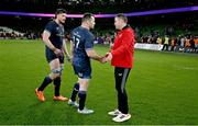18 January 2025; Bath head coach Johann van Graan shakes hands with Cian Healy of Leinster after the Investec Champions Cup Pool 2 match between Leinster and Bath at the Aviva Stadium in Dublin. Photo by Brendan Moran/Sportsfile