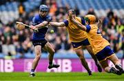 19 January 2025; Cathal McCarthy of Sarsfields in action against Peter Feeney, centre, and Kevin Burke of Na Fianna during the AIB GAA Hurling All-Ireland Senior Club Championship final match between Na Fianna and Sarsfields at Croke Park in Dublin. Photo by Ben McShane/Sportsfile