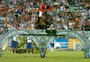 24 August 2004; Ludger Beerbaum on Goldfever on their way to securing the Gold medal for Germany during the final round of the Team Jumping Final. Markopoulo Olympic Equestrian Centre. Games of the XXVIII Olympiad, Athens Summer Olympics Games 2004, Athens, Greece. Picture credit; Brendan Moran / SPORTSFILE