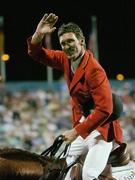 24 August 2004; Ludger Beerbaum on Goldfever celebrates securing the Gold Medal for Germany in the Team Jumping Final. Markopoulo Olympic Equestrian Centre. Games of the XXVIII Olympiad, Athens Summer Olympics Games 2004, Athens, Greece. Picture credit; Brendan Moran / SPORTSFILE