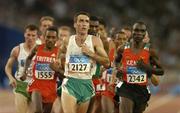 25 August 2004; Ireland's Mark Carroll (2127) checks the clock as he leads the field during his heat of the Men's 5000m. Olympic Stadium. Games of the XXVIII Olympiad, Athens Summer Olympics Games 2004, Athens, Greece. Picture credit; Brendan Moran / SPORTSFILE