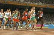 25 August 2004; Ireland's Mark Carroll (2127) and Kenya's Eliud Kipchoge (2342) lead the field during their heat of the Men's 5000m. Olympic Stadium. Games of the XXVIII Olympiad, Athens Summer Olympics Games 2004, Athens, Greece. Picture credit; Brendan Moran / SPORTSFILE